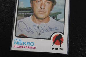 lot 48 image: 1973 Topps Phil Niekro #503 In Person Autograph Damaged - See Description