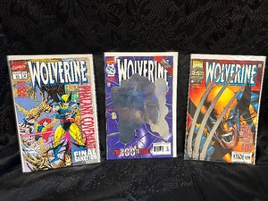 lot 14 image: 3 Holographic Wolverine Comic Books Mint Condition