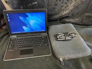 lot 82 image: Dell Laditude Laptop with Charger and Case (works)