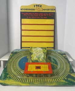 lot 22 image: Tin Litho Toy Train Display by Automatic Toy Co. and Vintage 1950s Wood Advertising Board by Community Billboard Service