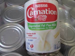 lot 589 image: 24- 12 oz Carnation Evaporated Fat ...