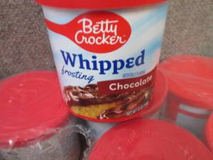 lot 499 image: 8- 12 oz Betty Crocker Whipped Choc...