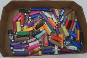 lot 3 image: Bic lighter lot and antique lighter