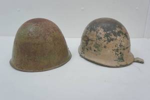 lot 11 image: Metal and Kevlar military helmets