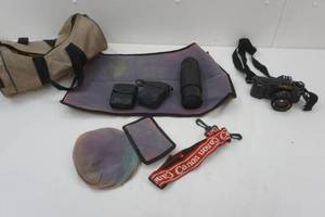 lot 34 image: Canon T50, telephoto, light meter and flash