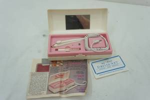 lot 57 image: Vintage hair removal tool