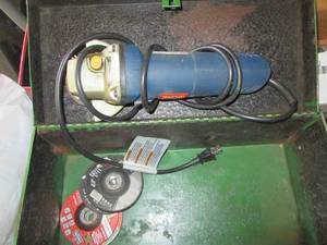 Green metal toolbox with Ryobi angl...