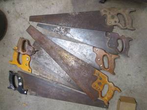 Variety of vintage hand saws...