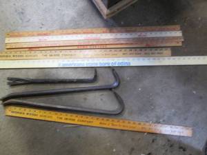 Yardsticks and cats paw pry bars...