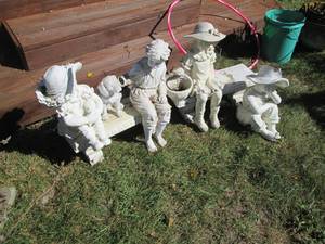 Family of children on benches outdo...