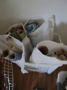 Tall laundry basket of assorted wra...