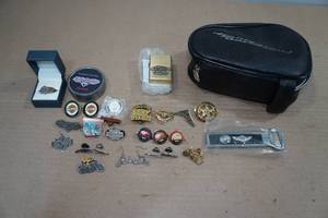 lot 303 image: Harley Davidson Pouch with Assorted Pins and Lighter