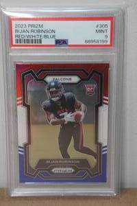 lot 2L image: 2023 Prizm Bijan Robinson RedWhiteBlue #305 Rookie Football Card - PSA 9