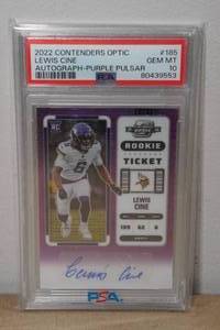 lot 2K image: 2022 Contenders Optic Lewis Cine Purple Pulsar Auto #185 Rookie Football Card - PSA 10