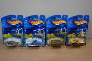 lot 35 image: 4 Hot Wheels Die Casts with Atomix Micro Vehicles