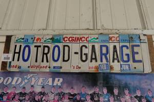 lot 98 image: Hot Rod Garage License Plate Sign