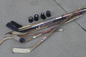 lot 609 image: Hockey Sticks and Pucks