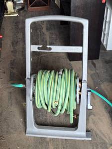 lot 52 image: Suncast Hose Reel Cart with Garden Hose