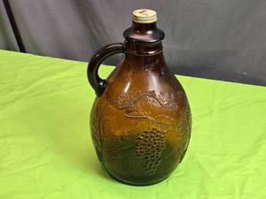 lot 122 image: Vintage Amber One Gallon Jug with Embossed Grapevine Design