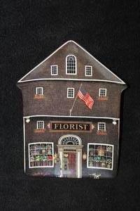 lot 476 image: Collectors Plate - The Town Florist by Charles Wysocki #12894A Limited Edition Fourth Issue in the Wysocki Folktown Collection from The Bradford Exchange with Certificate of Authenticity