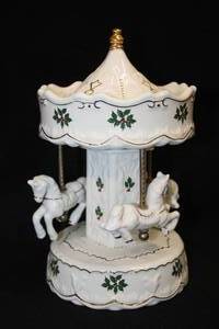lot 487 image: 10 Collectors Musical Carousel - (White with Misteltoe and Gold Trim)