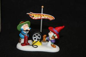 lot 570 image: Collectors Figurine - Hot Wheels Lets Give It A Spin in the Heritage Village Collection North Pole Series from Department 56