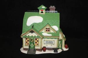 lot 583 image: Collectible House with Light - Van Guilders Ornamental Ironworks in the New England Village Series from Department 56