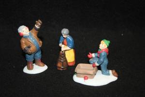 lot 1078 image: Collectors Figurines - Caroler, Kid with Presents, Mom with Churn - in the Heritage Village Series from Department 56