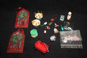 lot 1100 image: Lot of (18) Assorted Christmas and Holiday Decorations & Figurines, Little Red Wagon, Nutcrackers, Bottles of Wine and Beer on Ice, and more