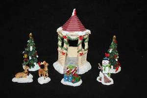 lot 1101 image: Lot of (7) Assorted Holiday Figurines - Gazebo, Christmas Trees, Snowman, Reindeer and Presents