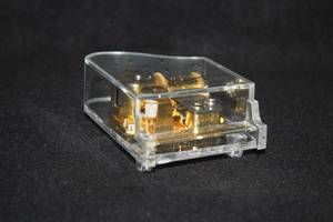 lot 1142 image: Piano theme Clear Plastic Music Box