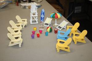 lot 1180 image: Lot of (22) Assorted Beach theme Figurines - Lifeguard Chair, Adirondack Chairs, Lounger, Sufr Board, Pails, Sand Castle, Umbrella