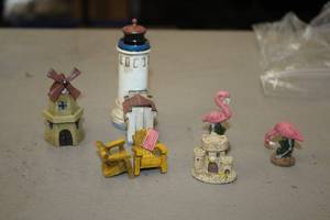 lot 1184 image: Lot of (7) Assorted Collectible Figurines - Light House, Windmill, Pink Flamingoes, Lawn Chairs