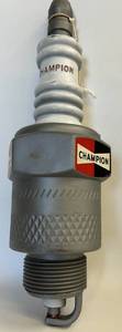 lot 30 image: Vintage 1950S Lg. Plastic Champion Spark Plug & Champion BOB UNSER Advertisement