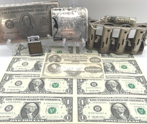 lot 76 image: The Money Lot #2 - Includes 1995 Uncirculated Sheet of $1 Bills, Vintage Coin Changer, Vintage Cigarette Holder and Bill Holder & More