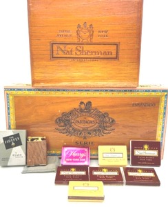 lot 84 image: Wood Cigar Boxes From Partagas & Nate Sherman NY, 1920s Ostrich Firefly Lighter, Vintage Harrys NY Bar Matches, 6 Nate Sherman Match Boxes