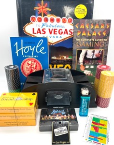 lot 107 image: Las Vegas Lot-Includes 3 Books, Playing Cards, Card Shuffler, New Poker Chips and More.