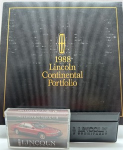 lot 131 image: 17 Vintage Lincoln Ads, 1988 Lincoln Continental Portfolio, 1994 Mark VIII Manual, Faux Leather Pouch