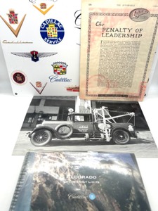 lot 146 image: Metal Cadillac Sign, Photo of Cadillac Tow Truck, 1915 Ad, NSO Eldorado Pkg.