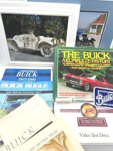 lot 175 image: Large Buick Lot Includes 2 Framed Pictures, 8 Vintage Ads & More