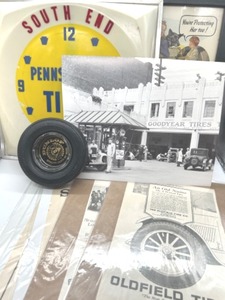 lot 238 image: Tire Advertising Lot Includes Pennsylvania Tire Clock, 1945 Framed Fisk Tire Ad, Dunlop Tire Ashtray & More