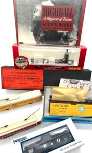lot 247 image: 6 HO Scale Train Cars & 1 Hardcover Book