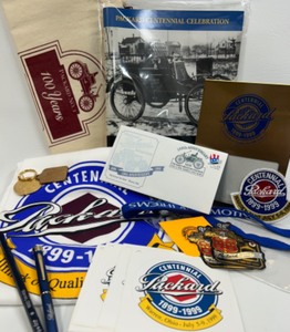 lot 270 image: Packard 100th Anniversary - Includes 1999 Packard Centennial Celebration Program, Picture Frame, Keychain & More
