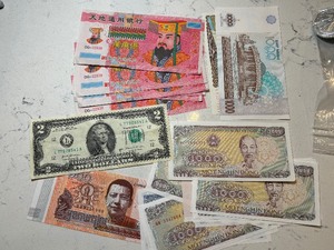 Foreign Currency and $2 Dollar Bill