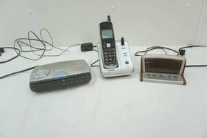 lot 77 image: Clock radios and V-Tech phone