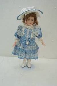 lot 90 image: Tiffany Pacini collection ceramic face doll 17