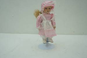lot 93 image: 16 porcelain faced doll