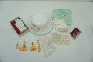 lot 109 image: Hat and gloves, with candle drapes