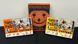 lot 61 image: Vintage Trick or Treat Cookie Cutters and Pumpkin Face Ring Toss Game