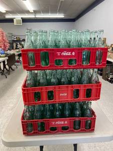 lot 61 image: Glass Coca-Cola Bottles (100) in Coca-Cola Totes